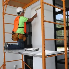 Heavy-duty Louisville Ladder industrial ladder in an industrial setting